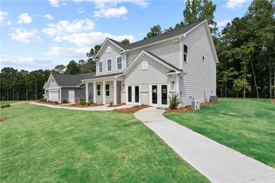 View of front facade featuring french doors, board and batten siding, a front yard, an attached garage, and cooling unit