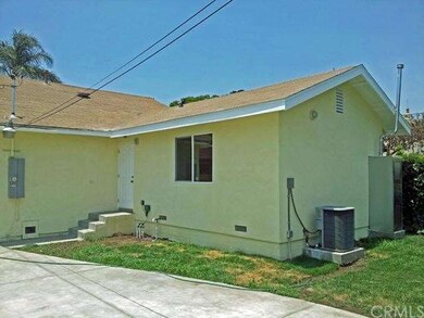 Back view: AC unit and water heater.