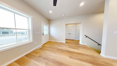 Empty room with recessed lighting, light wood-style floors, and a ceiling fan