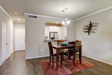 The dining area is open to the kitchen and has an