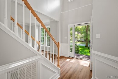Foyer entrance featuring hardwood / wood-style flo