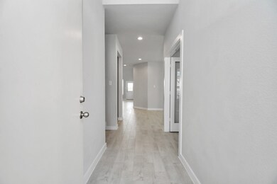 As you step into the threshold of this luxurious home, you'll soon be welcomed by an elegant glass door (to be installed). Inside, soaring ceilings amplify the spaciousness, while the refined wood-look tile flooring and oversized baseboards exude sophistication and charm. Sample photo of completed home with similar floor plan. Actual colors and selections may vary.
