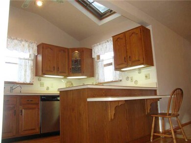 Kitchen. Ceramic Back splash & Skylight in Cathedr