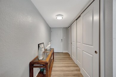 Your front entry way has a full wall of closets for storage