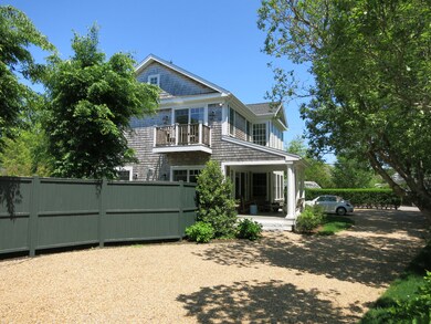 Looking back from garage to Main house with Master bedroom balcony.