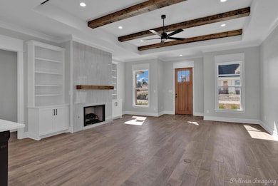 Unfurnished living room with light wood-style floo