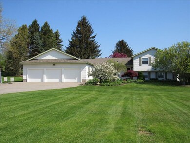 3 car attached garage. Cement driveway
