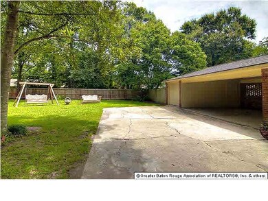 Rear carport with storage and large side yard