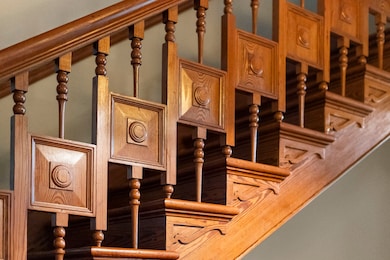 This intricate heart-of-pine staircase showcases t