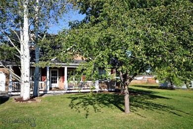 Mature trees in front yard including a great apple