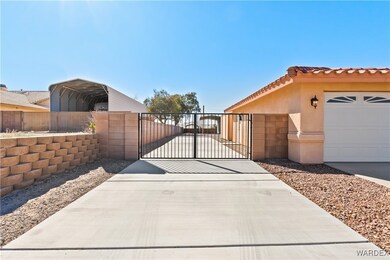 View of gate featuring fence