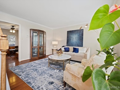 Living room with wood finished floors, ornamental