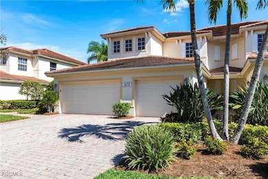 Mediterranean / spanish-style home with decorative driveway, stucco siding, and a tile roof