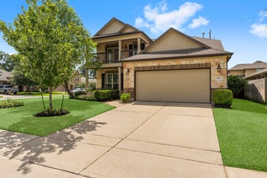 Beautiful two-story home features a stone and bric