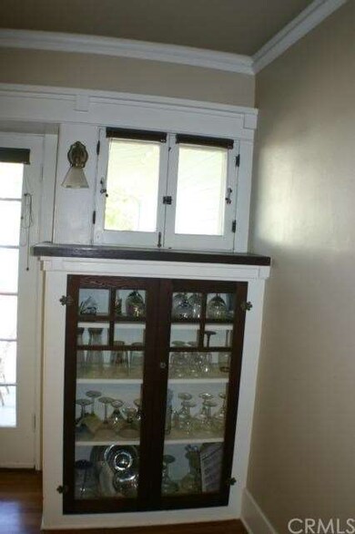 Notice the sconce, cute operable windows, crown mo