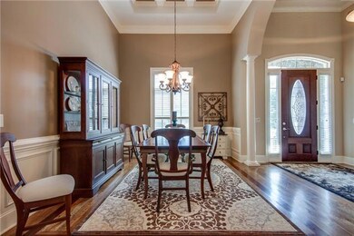 With high, coffered ceilings, inlaid wood flooring, columns, wainscoting, chair rail and crown molding, this Dining Room will impress your guests.
