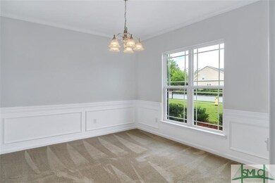 Dining room with side rail trim is 10'11 X 12'3