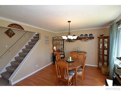 Dining Room. Dining rm with laminate floor & crown