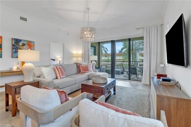 Living room featuring floor to ceiling windows, li