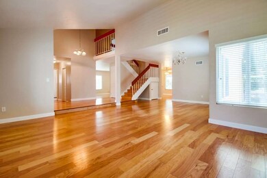 Living room/dining room shows the easy-flow to the