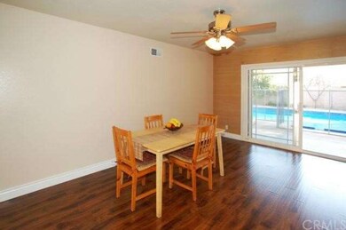 Family room looking towards rear yard with pool & 
