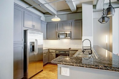 Beautiful stainless steel kitchen with granite cou