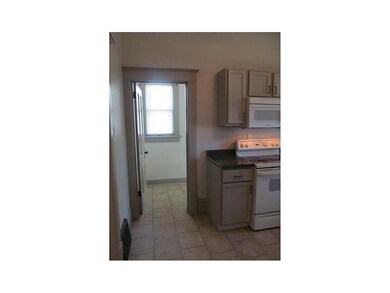 Kitchen. Doorway leading to mudroom and back door.