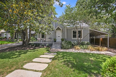 View of front of property with a carport
