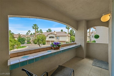 View of patio featuring a balcony and a residentia