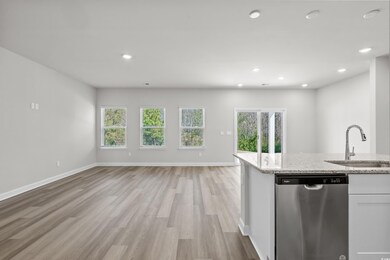 Kitchen featuring dishwasher, open floor plan, a s