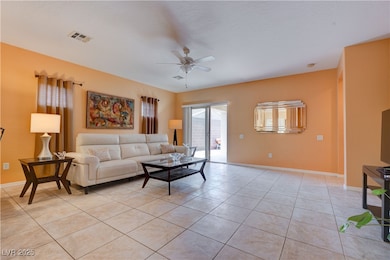 Living room with light tile patterned floors, base