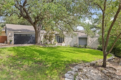 Mid-century modern home with stone siding, a shin