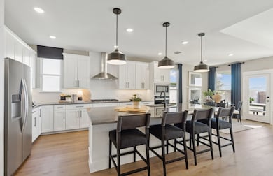 Spacious eat-in kitchen designed with a large island for dining *Model representation
