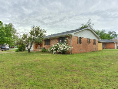 View of side of home featuring brick siding and a 
