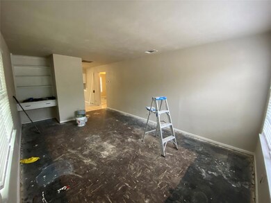 Living Room **Home interior and exterior under construction. New floors, paint, fixtures and appliances to come.**