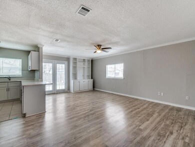 Unfurnished living room featuring light wood finis