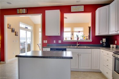 A peek-through window sits above the kitchen sink 
