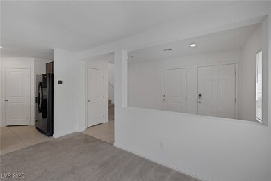 Unfurnished room featuring stairway, light tile pa