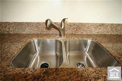 stainless steel sink and granite counter top