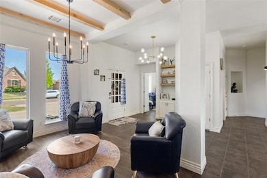 Living room featuring a chandelier, visible vents,