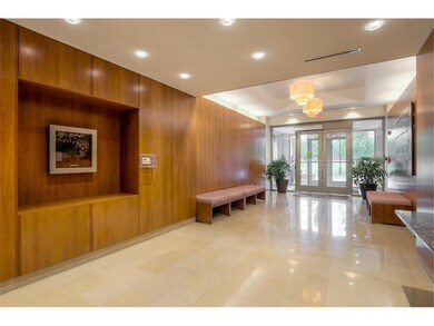 This immaculate lobby impresses with wood and marb