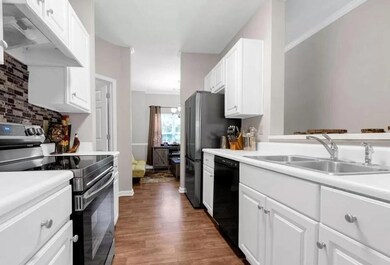 Kitchen featuring stainless steel electric range, 