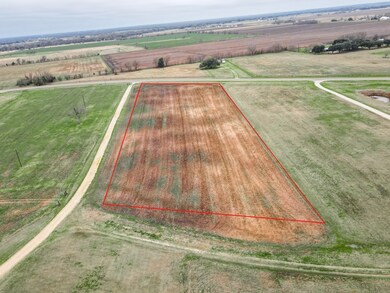 Birds eye view of property featuring a rural view