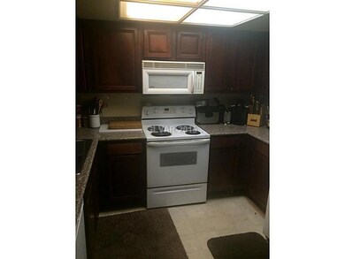 Kitchen. Step saver kitchen with granite counter.