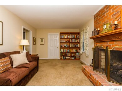 LIVING ROOM W/ BRICK FIREPLACE