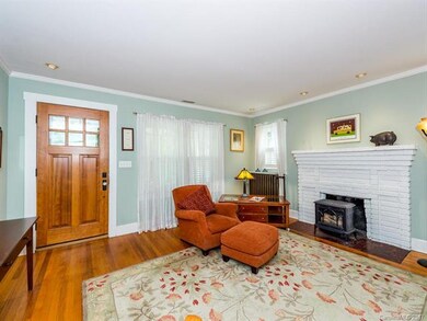 Living room with gas log stove.