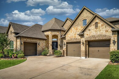 Stone and Brick elevation with 3-car garage