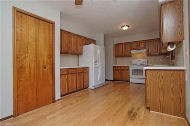 Hardwood flooring in this spacious kitchen with Co