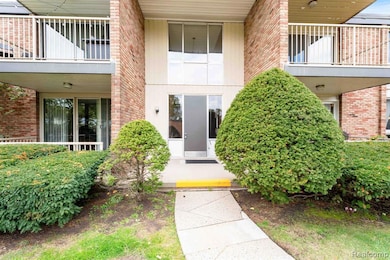 Property entrance featuring brick siding