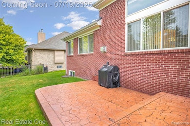 Stamped concrete 2-tier patio refreshed 2025